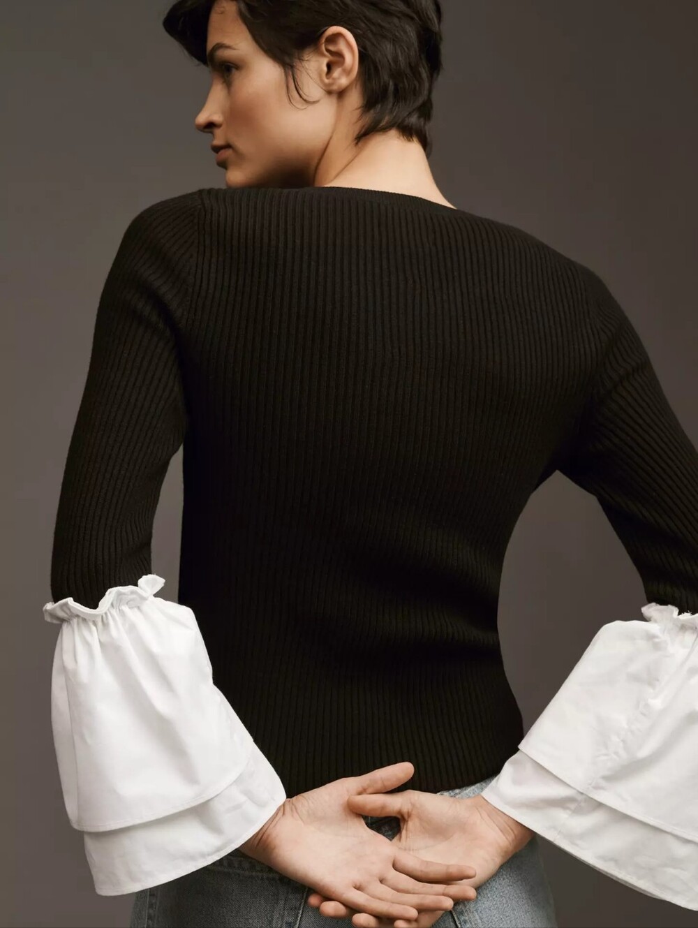 Anthropologie Black Ribbed Knit Top with White Ruffled Sleeve Details